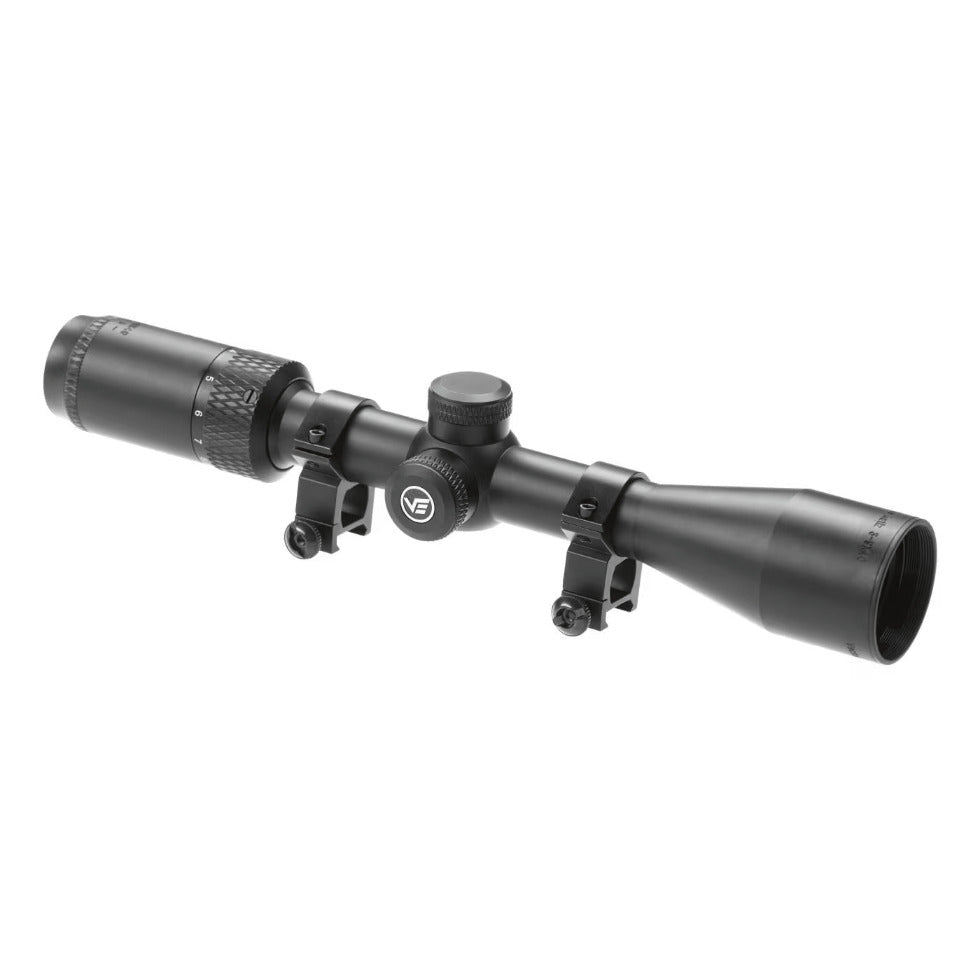A black rifle scope with adjustment knobs and mounting brackets, shown at an angle on a plain white background.